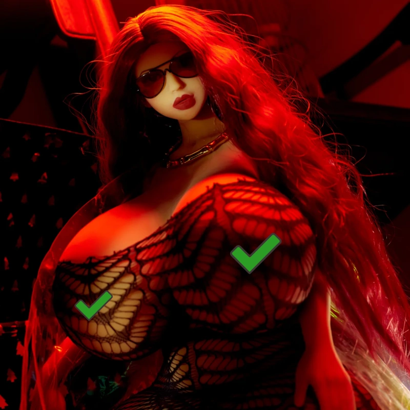 A stylized doll with long red hair and sunglasses, wearing a black lace outfit, highlighted in red lighting.