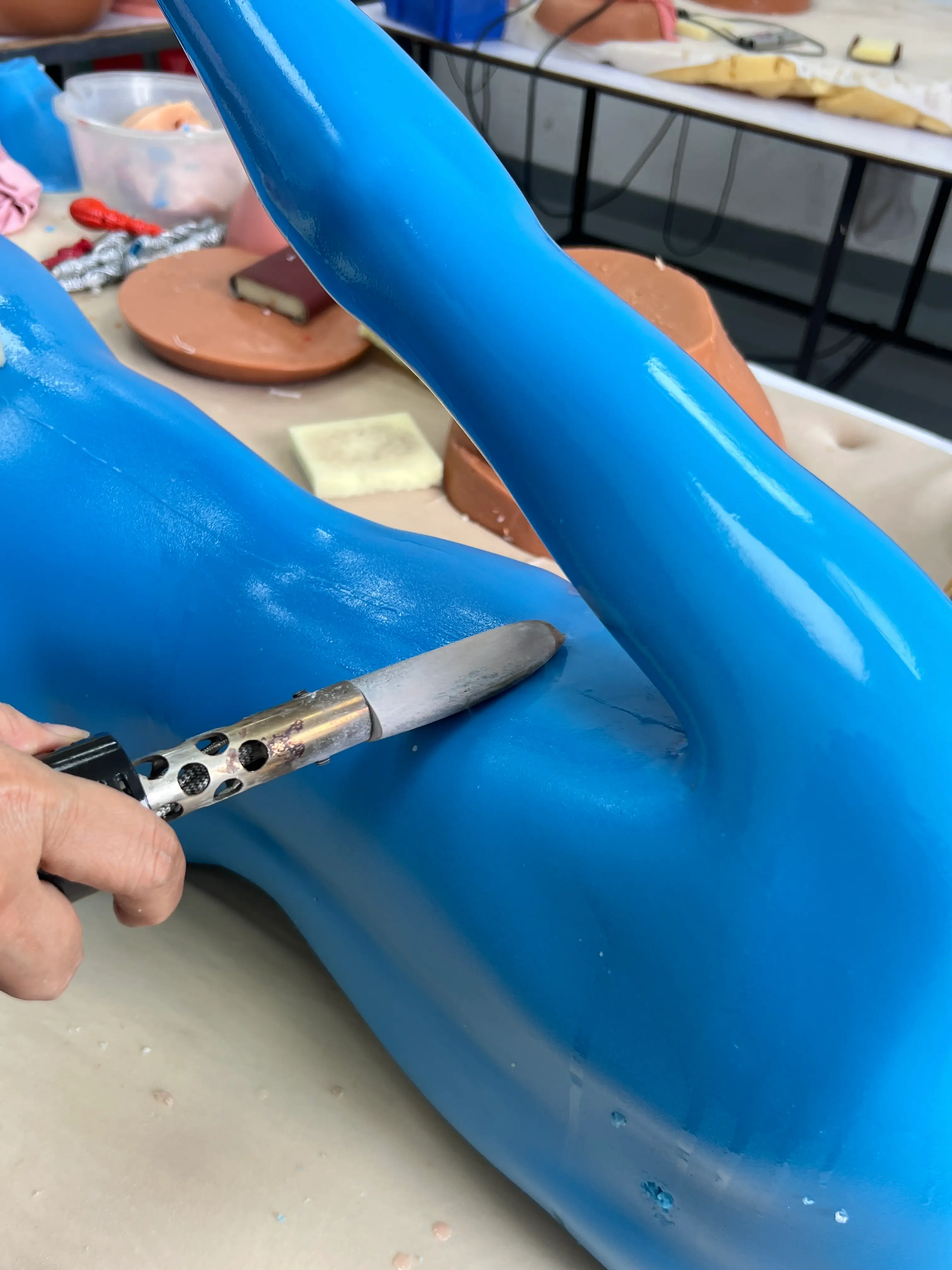 Manual surface finishing performed inside the Climax Doll factory